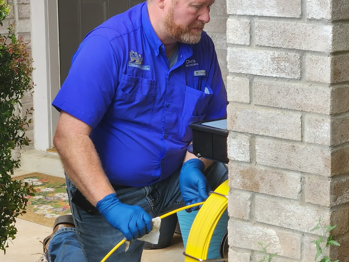 Kissee Inspections inspector running a sewer scope camera