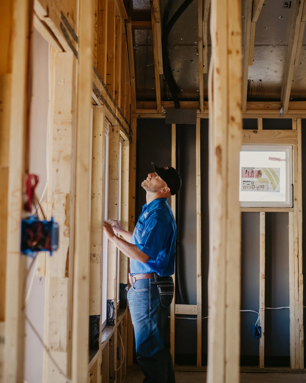 Kissee Inspections inspector checking the framing on a new build